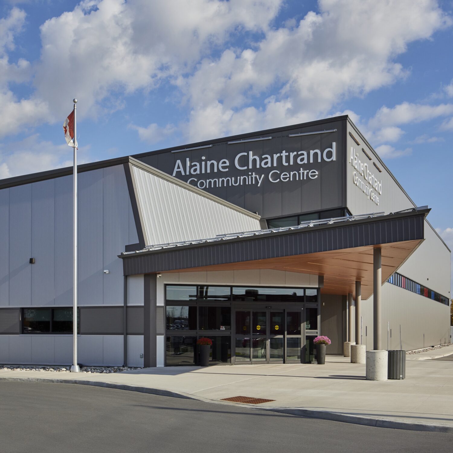 Entrance way of Alaine Chartrand Community Centre, showing doorway and exterior signage